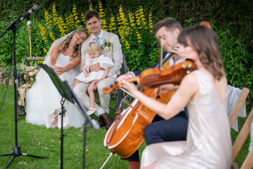 Bride and Groom listen to music natural wedding photo