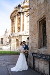 Bride and Groom at the Radcliffe Camera Oxford. Oxford University Wedding Photography by Matthew Ellacott Photography