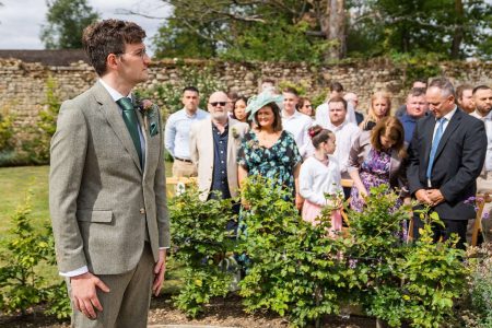 Outdoor wedding ceremony at The Medley Walled Garden in Oxford
